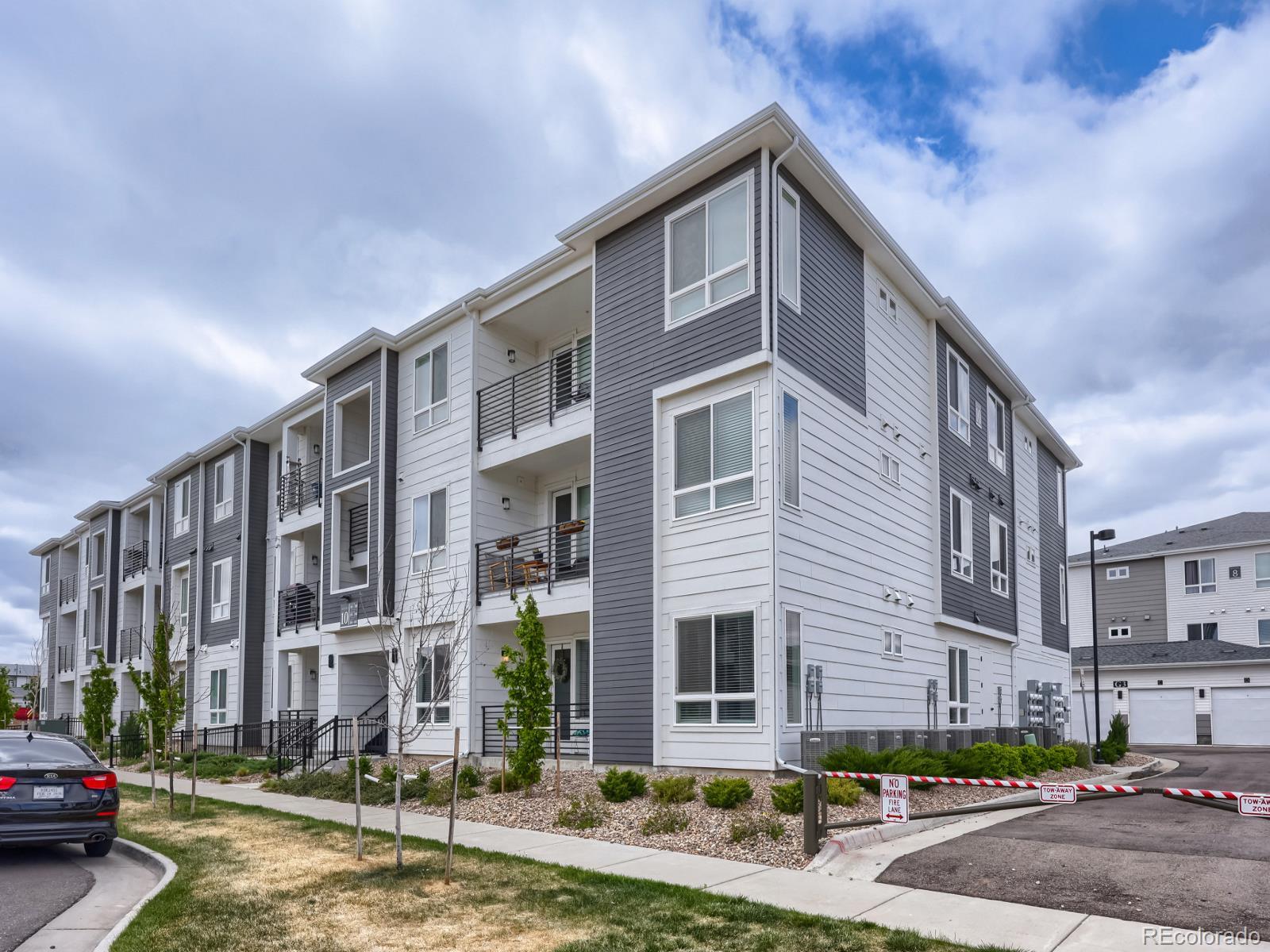 6153 North Ceylon Street, Unit 10108 Denver, CO 80249 - Photo 10 of 11 a front view of a building with street