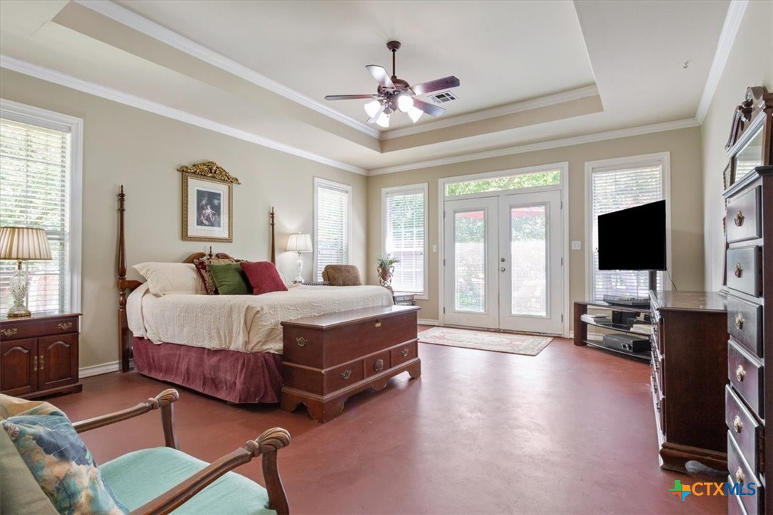 200 Carriage House Road Salado, TX 76571 - Photo 18 of 43 Spacious primary bedroom with french doors to the outside deck.