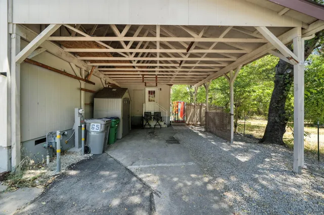 a view of a garage with wooden floor and roof