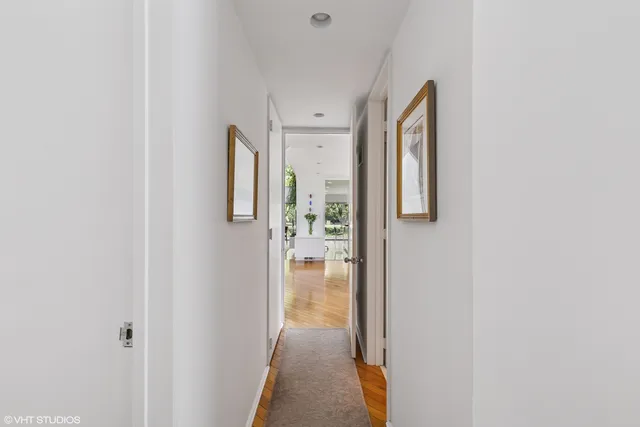 a bedroom with a bed and flat screen tv