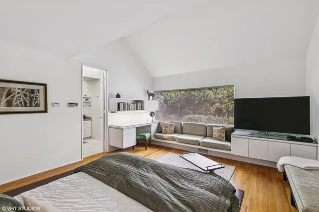 a view of a livingroom with furniture and workspace