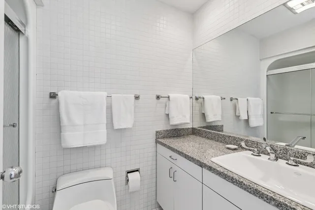 a living room with furniture rug and a fireplace