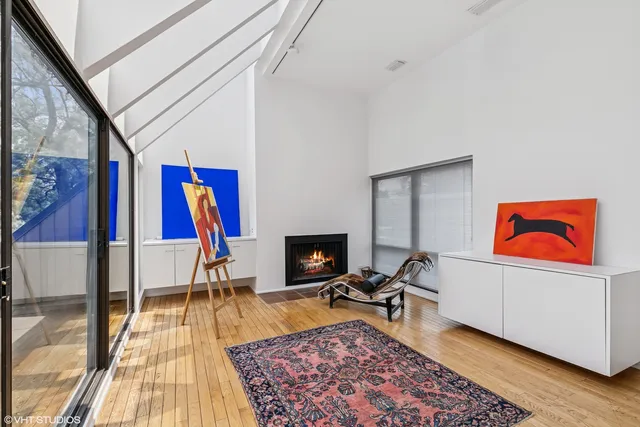 a hallway with a bed and a couch