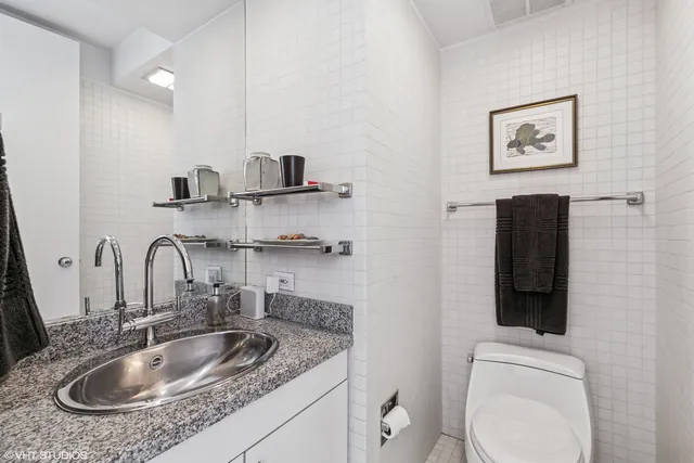 a front view of a house with a yard table and chairs