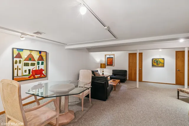 a view of a back yard with a tree