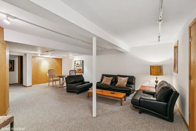 an aerial view of a residential houses with yard