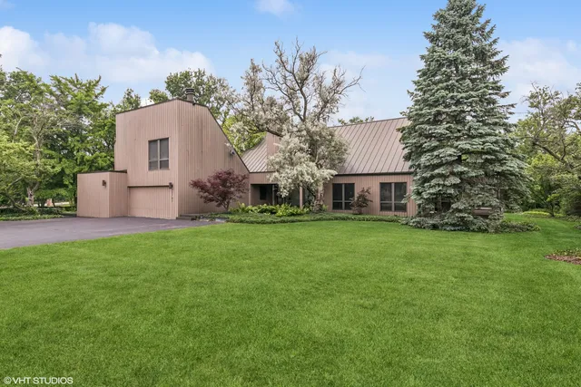 a black and white umbrella in front of house