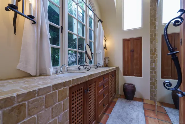 a bathroom with a double vanity sink and a mirror