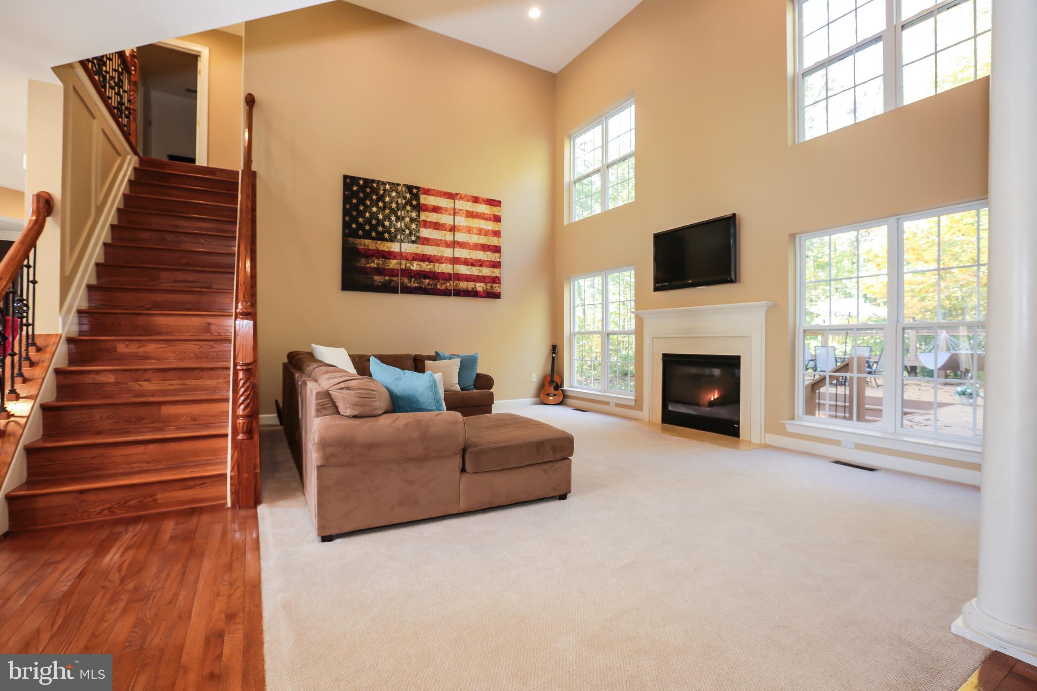 16013 Roland Park Place Gainesville, VA 20155 - Photo 7 of 31 Spacious Living Room with Bright Natural Lighting