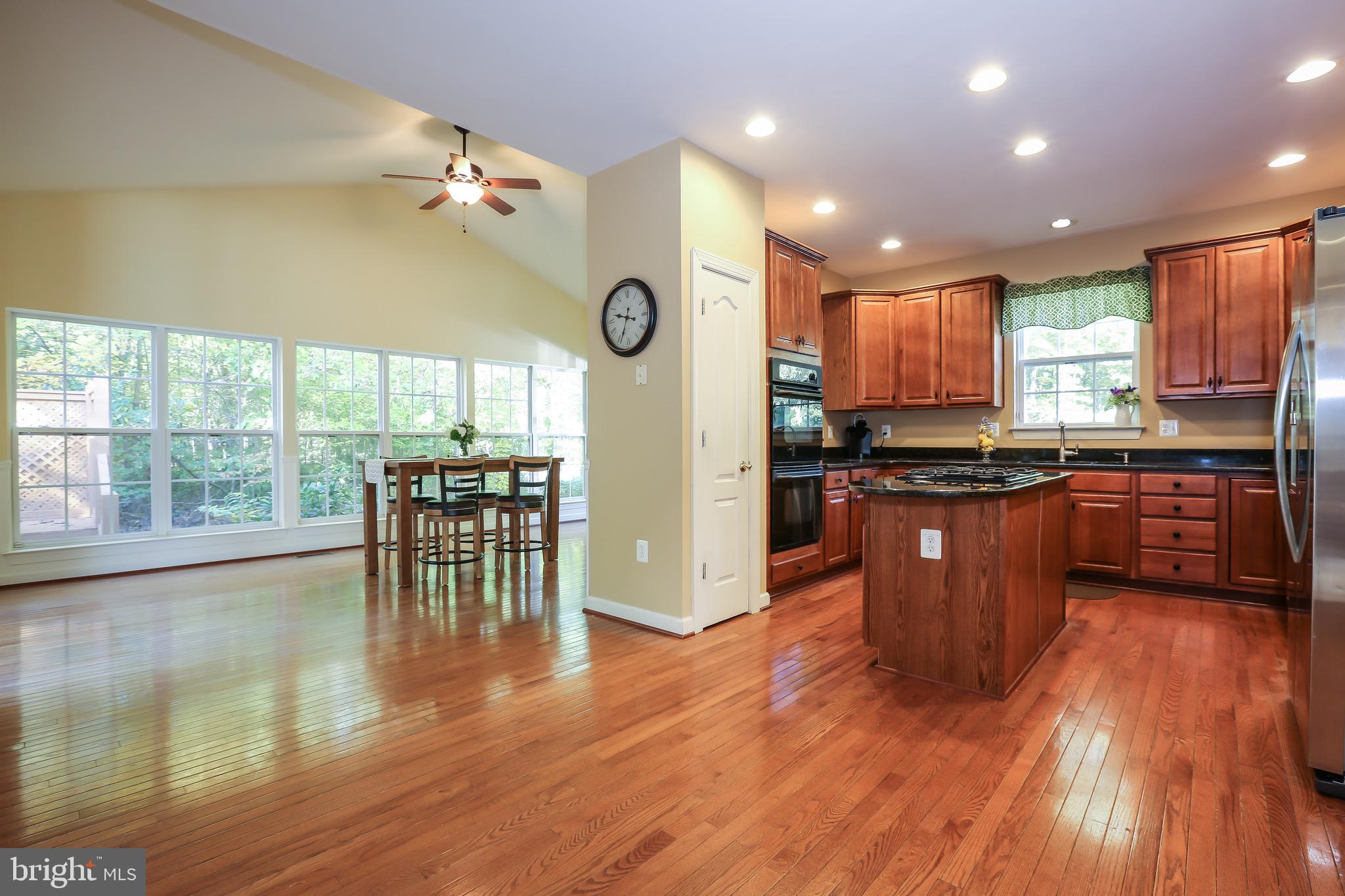 16013 Roland Park Place Gainesville, VA 20155 - Photo 9 of 31 Open Kitchen Space into Dining Area