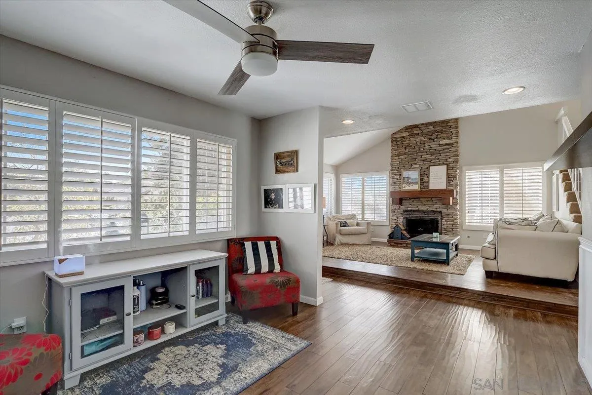 4094 Tambor Road San Diego, CA 92124 - Photo 11 of 49 a living room with furniture and a fireplace
