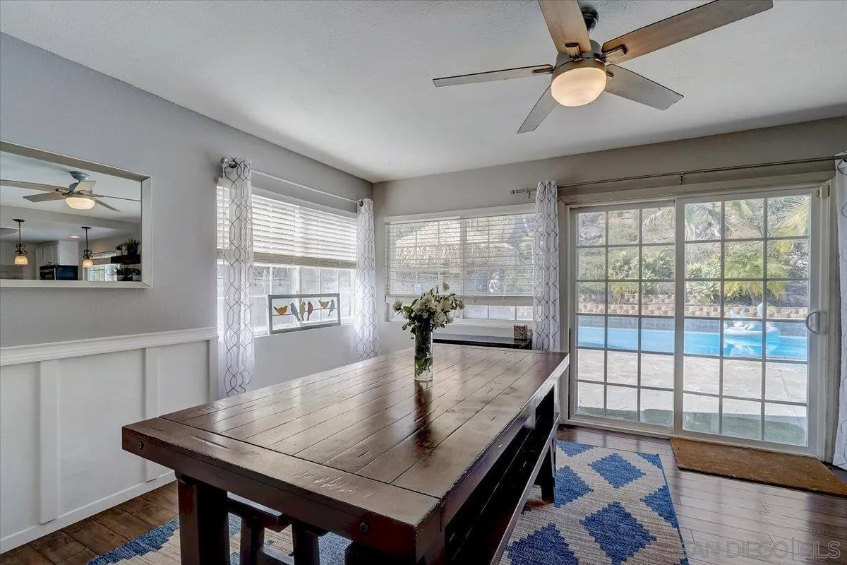 4094 Tambor Road San Diego, CA 92124 - Photo 13 of 49 a view of a dining room with furniture window and wooden floor