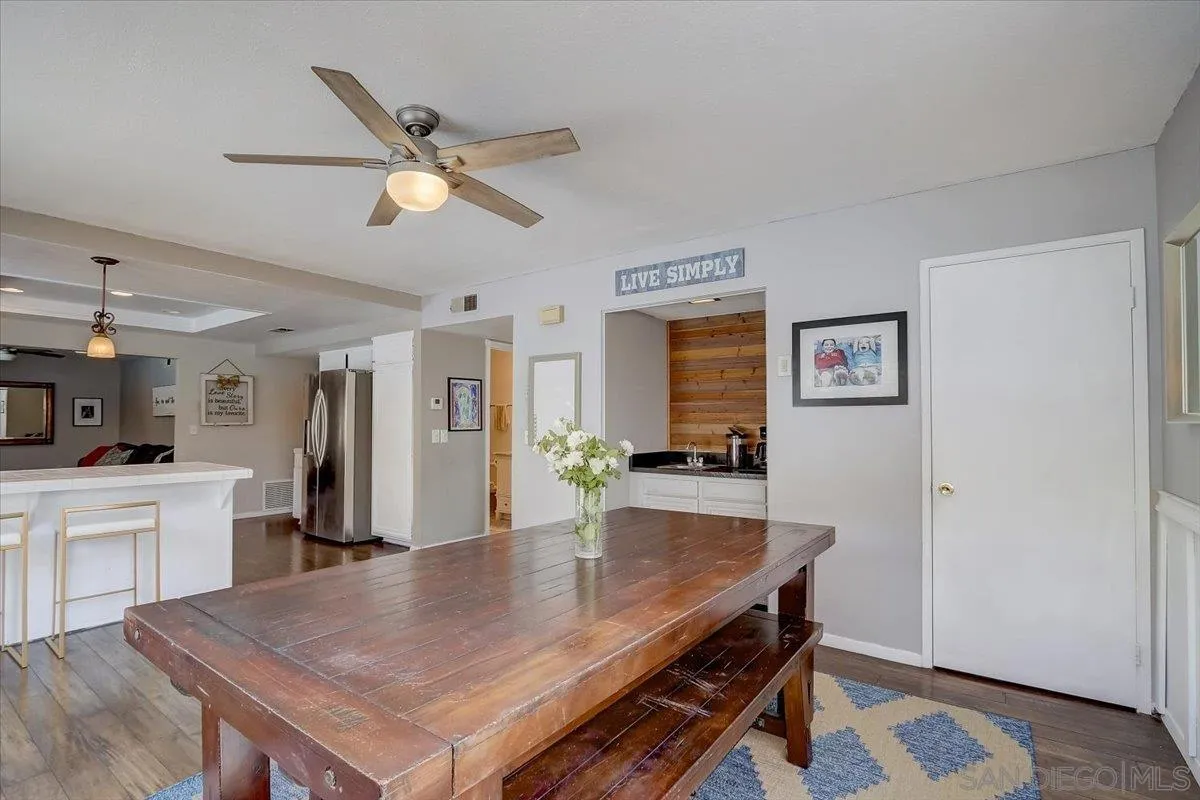 4094 Tambor Road San Diego, CA 92124 - Photo 15 of 49 a dining room with kitchen island a table and chairs