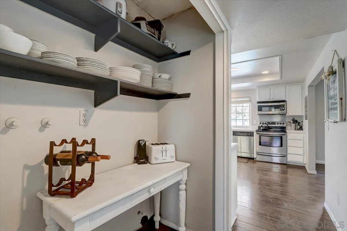 4094 Tambor Road San Diego, CA 92124 - Photo 20 of 49 a kitchen with cabinets and appliances