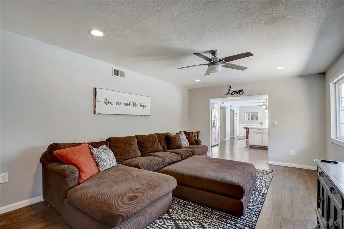 4094 Tambor Road San Diego, CA 92124 - Photo 21 of 49 a living room with furniture and a ceiling fan
