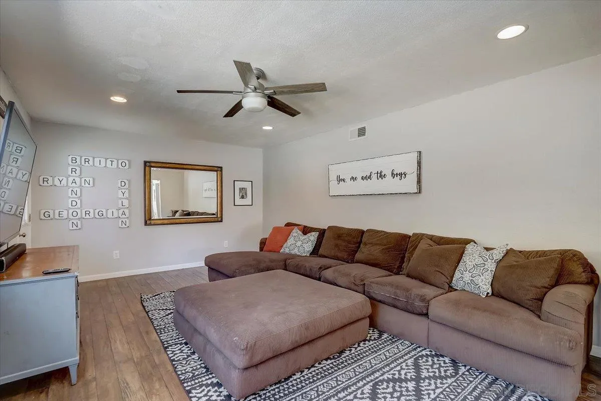 4094 Tambor Road San Diego, CA 92124 - Photo 23 of 49 a living room with furniture and a couch