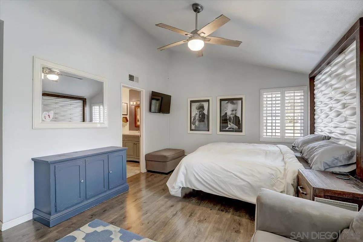 4094 Tambor Road San Diego, CA 92124 - Photo 26 of 49 a spacious bedroom with a bed a window and dresser