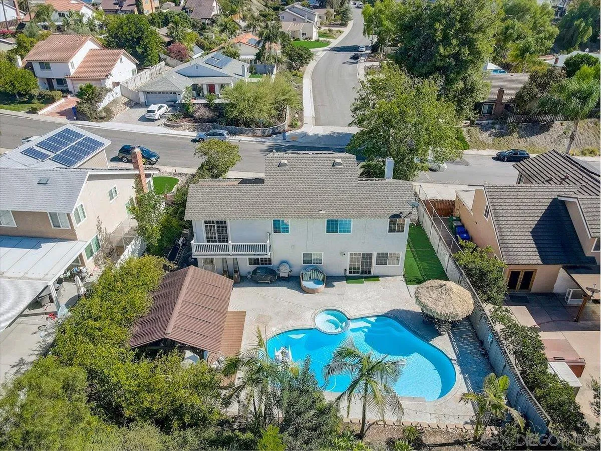 4094 Tambor Road San Diego, CA 92124 - Photo 44 of 49 an aerial view of a house with swimming pool and a yard