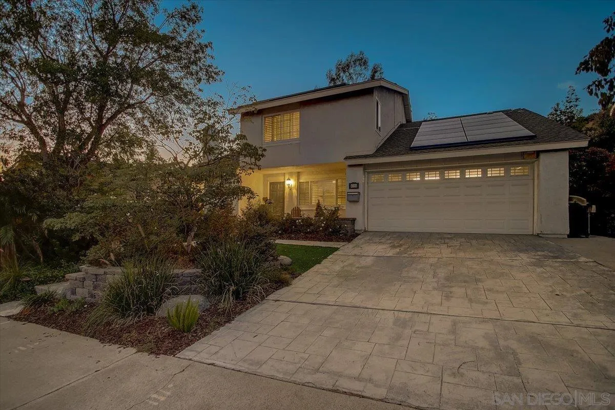 4094 Tambor Road San Diego, CA 92124 - Photo 5 of 49 a front view of a house with a yard and garage