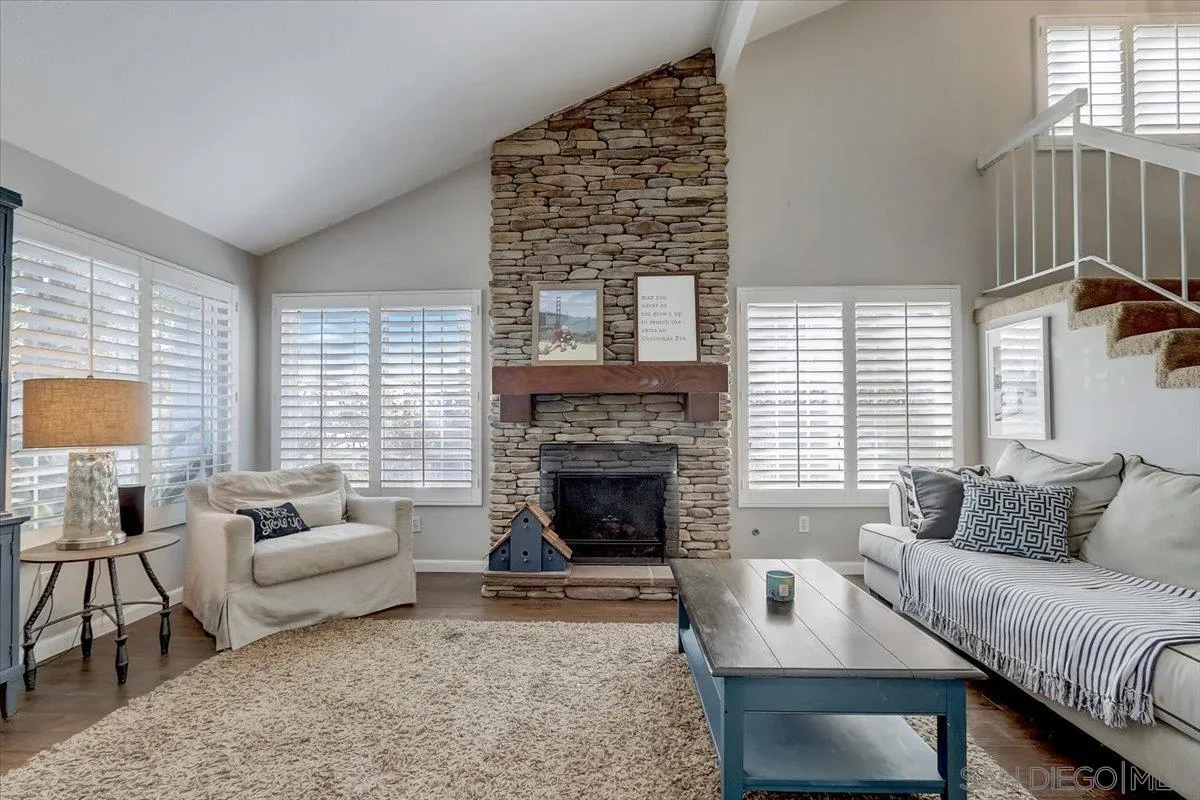 4094 Tambor Road San Diego, CA 92124 - Photo 8 of 49 a living room with furniture and a fireplace