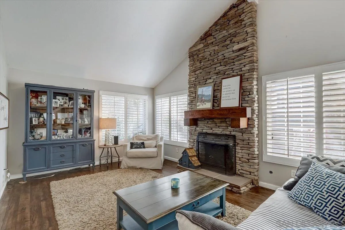 4094 Tambor Road San Diego, CA 92124 - Photo 9 of 49 a living room with furniture and a fireplace