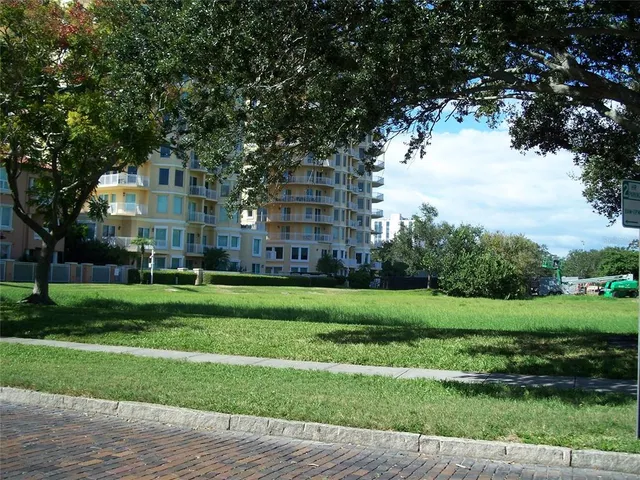 a view of a big yard next to a house