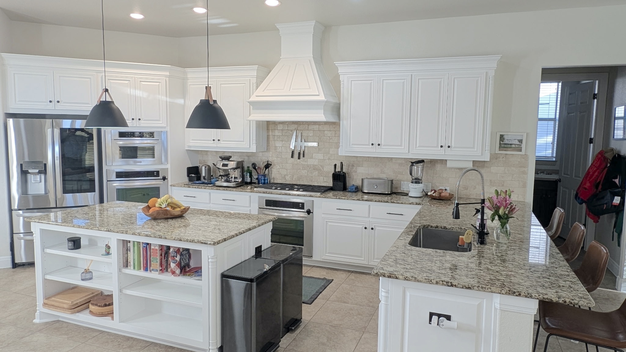 4205 Vail Divide Bee Cave, TX 78738 - Photo 5 of 28 Gourmet kitchen featuring a breakfast bar and an island with open shelves