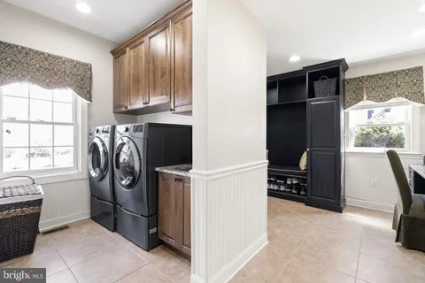 a view of cabinets and washer dryer