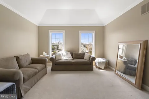 a bathroom with a granite countertop sink a toilet and a mirror