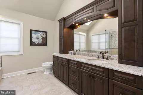 a spacious bathroom with a bathtub and a shower