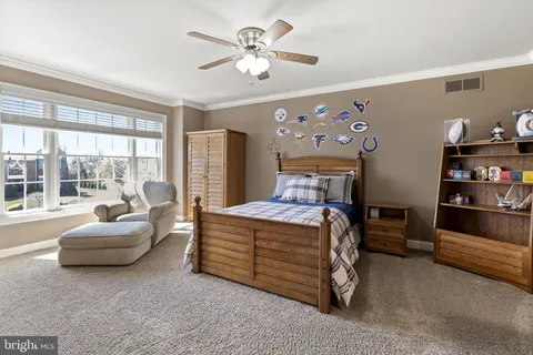 a kitchen with cabinets and washer dryer