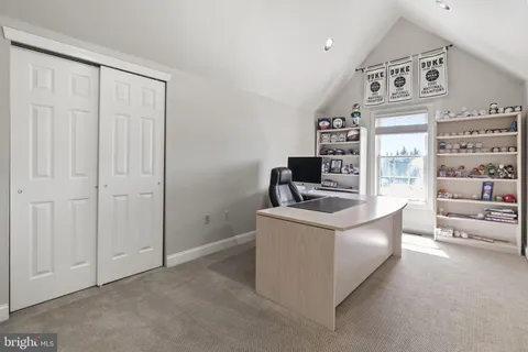 a view of a hallway with windows