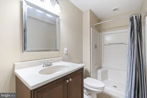 a backyard of a house with barbeque oven table and chairs