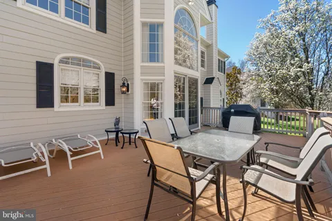 a view of a building with dining table and chairs