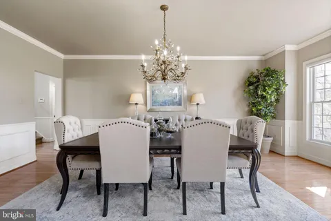 a view of a dining room with furniture and window