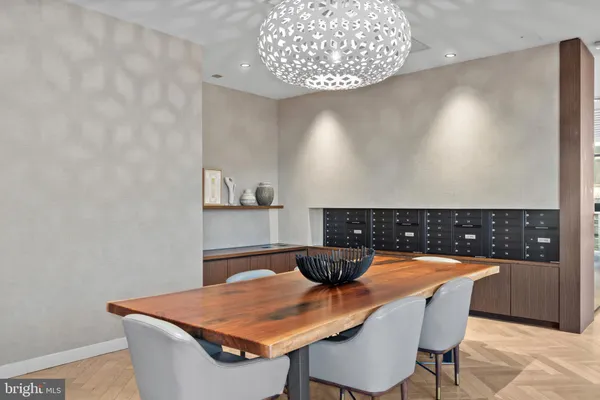 a dining room with a table and chairs