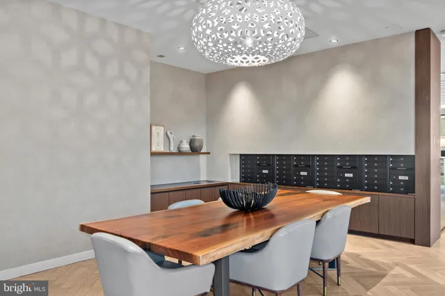 a dining room with a table and chairs