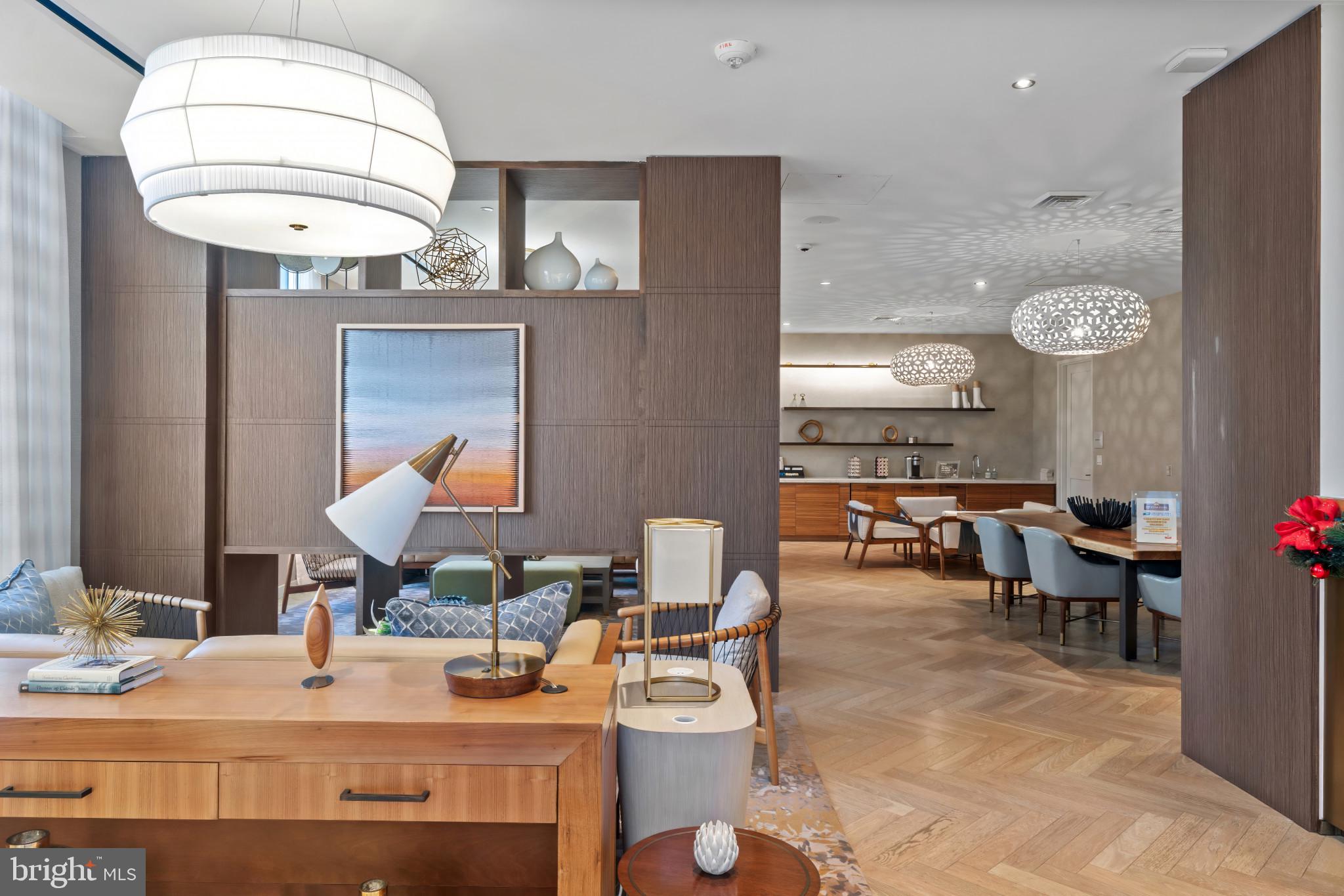1330 Lancaster Street, Unit C602 Baltimore, MD 21231 - Photo 27 of 28 a living room with furniture a window and a table