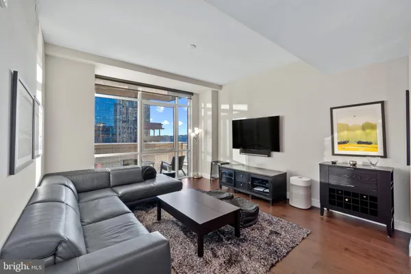 a living room with furniture and a flat screen tv