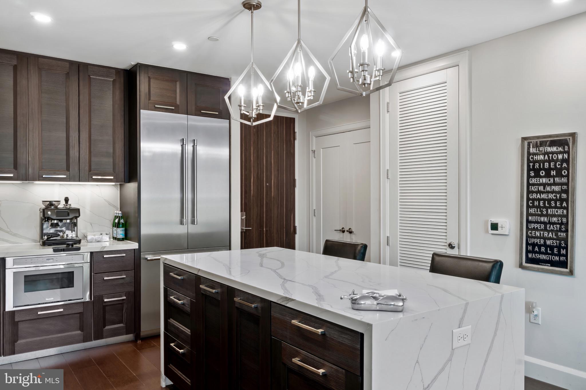 1330 Lancaster Street, Unit C602 Baltimore, MD 21231 - Photo 9 of 28 a kitchen with stainless steel appliances a stove a refrigerator a sink and dishwasher