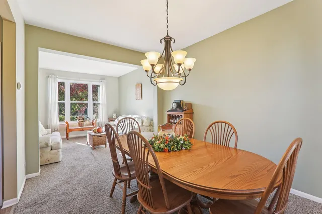 a kitchen with stainless steel appliances granite countertop a stove a refrigerator and a sink