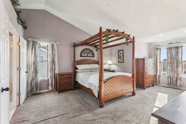 a bedroom with a bed and with furniture