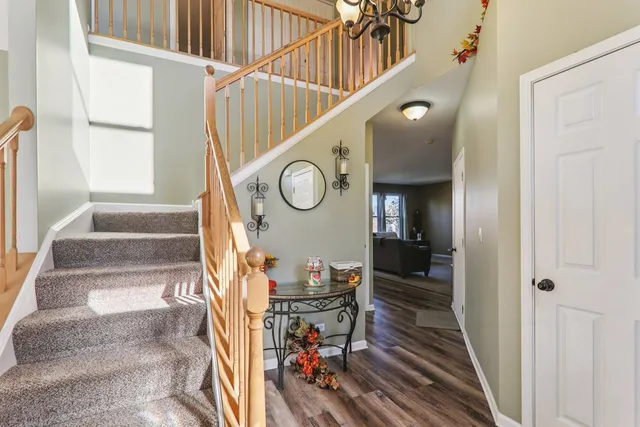 a living room with furniture a window and a fireplace