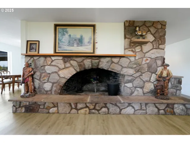 a black and white photo of a fireplace