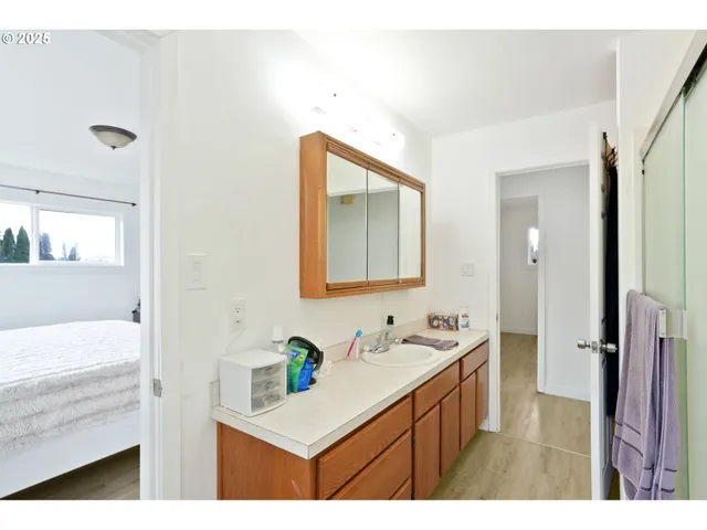 a bathroom with a sink double vanity and a mirror