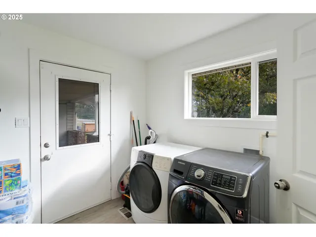 a utility room with dryer and washer