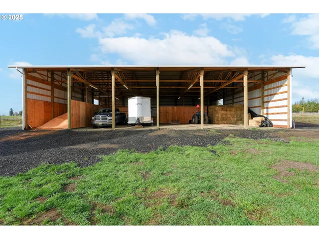 a front view of a house with porch and garden