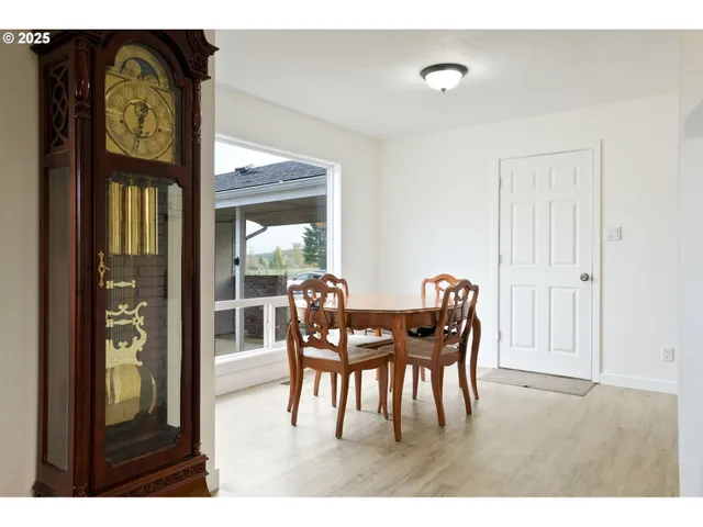a view of a dining room with furniture and chandelier