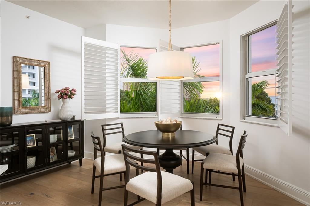 470 Launch Circle, Unit V401 Naples, FL 34108 - Photo 1 of 32 a view of a dining room with furniture window and outside view