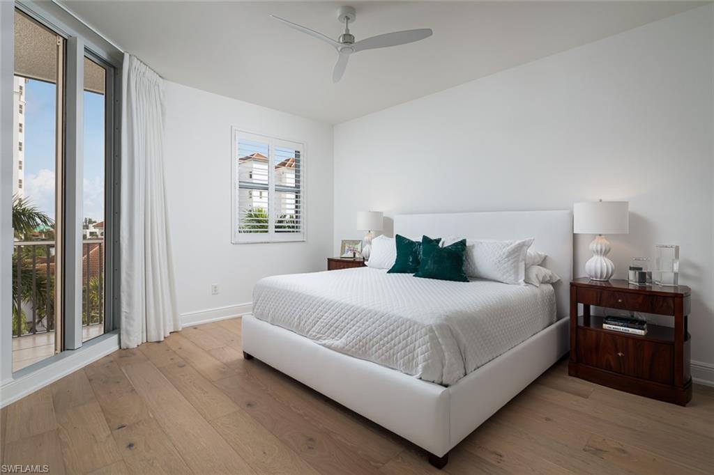 470 Launch Circle, Unit V401 Naples, FL 34108 - Photo 11 of 32 a bedroom with a bed and window